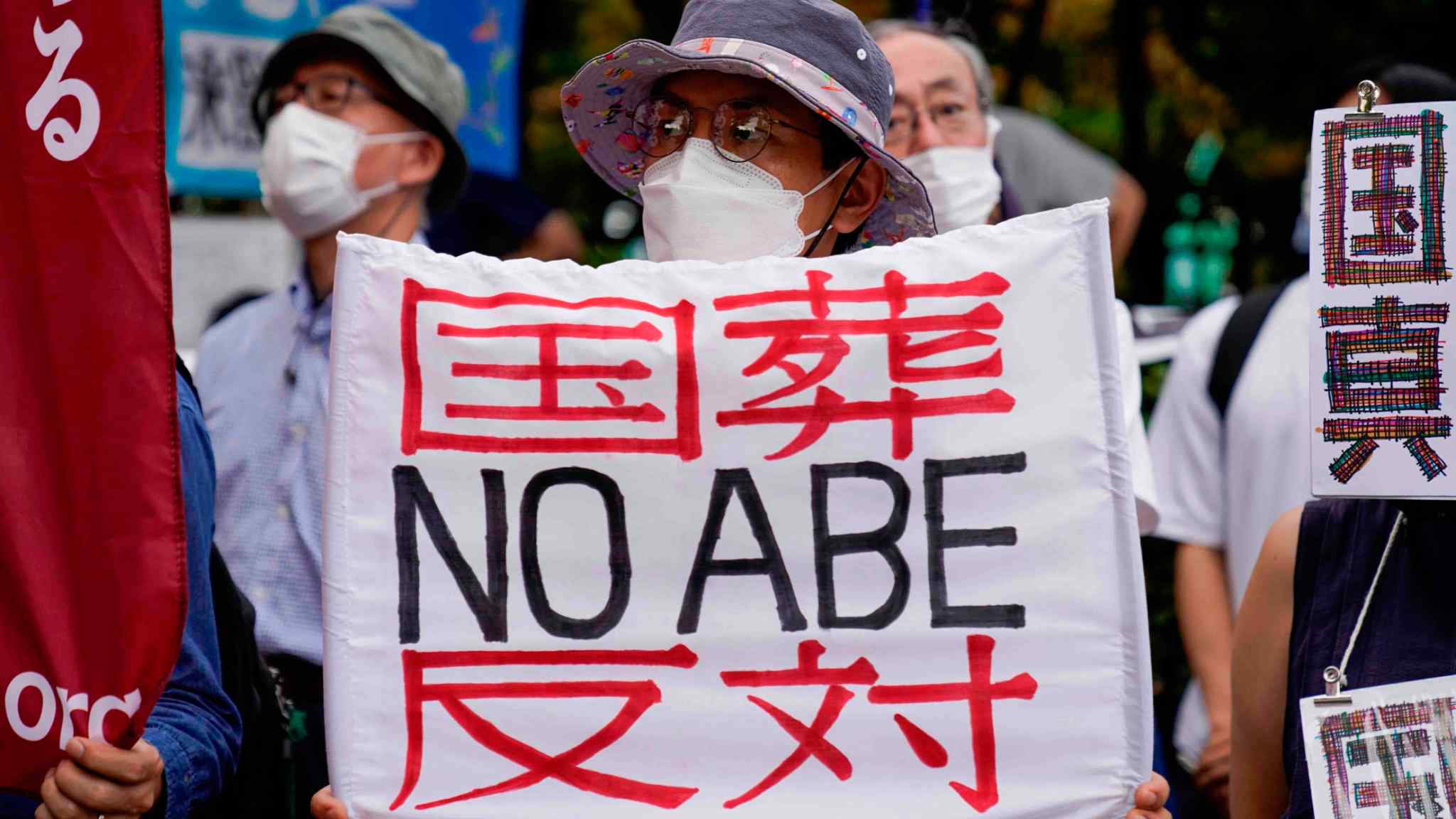 Protesters march on Japan’s parliament to criticise Abe state funeral