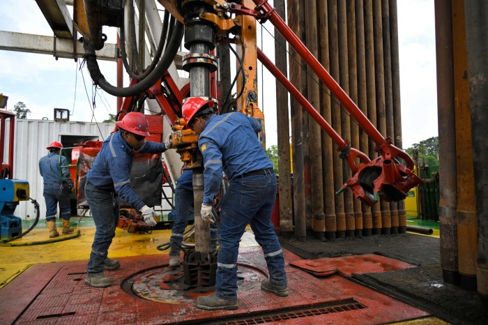 Workers at an oil well