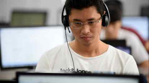 An employee, photographed in 2016, works inside the French IT company Linkbynet in Ho Chi Minh City