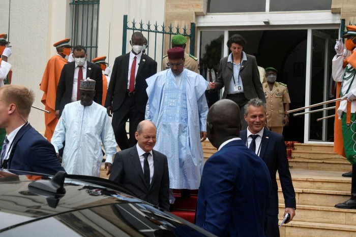 Niger’s president Mohamed Bazoum (centre) and German chancellor Olaf Scholz leave the Presidential Palace in Niamey, Niger, in May this year
