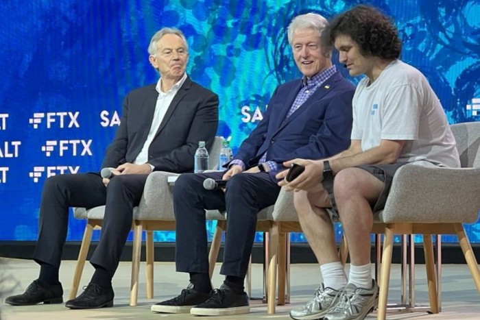 Tony Blair, left, Bill Clinton, center, and Sam Bankman-Fried at an FTX event in the Bahamas in April 2022