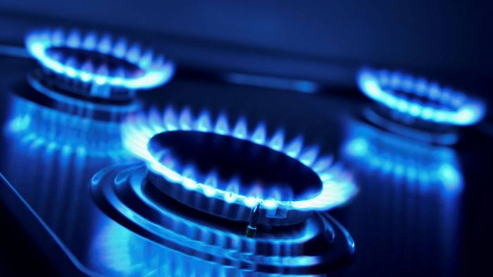 three gas hobs lighted up