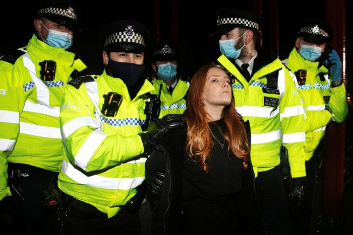 A protester is arrested by Met officers during last year's guard for murder victim Sarah Everard