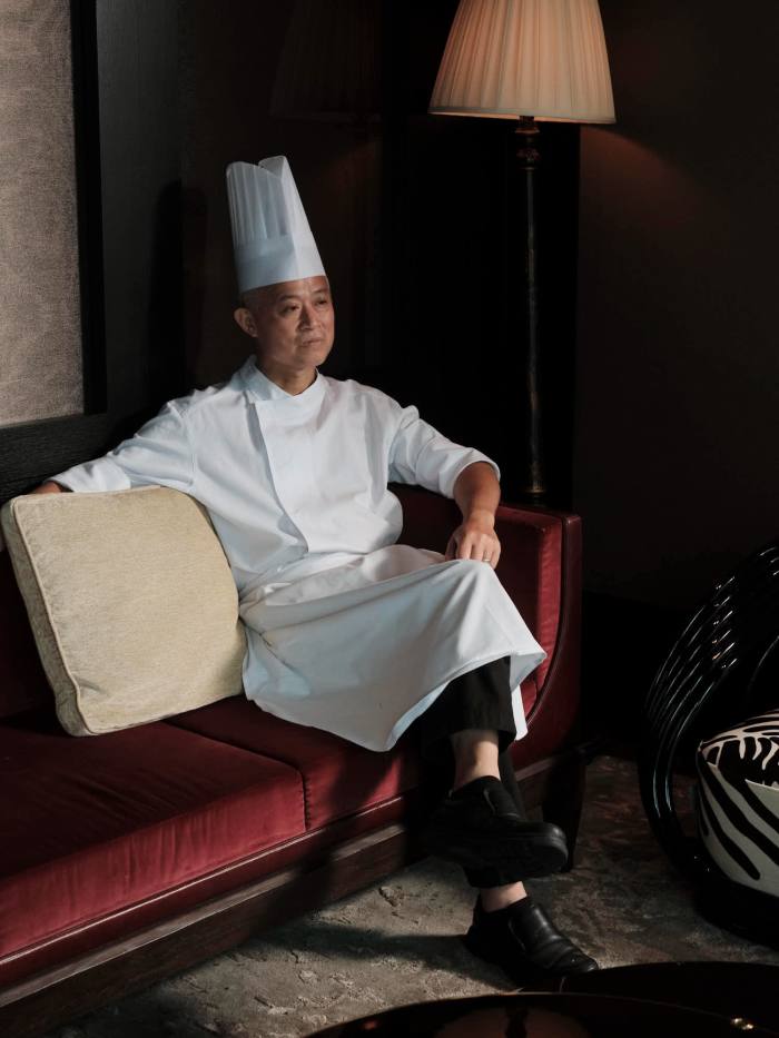 Executive Chef Li Chi Wai from The Legacy House sitting on a sofa