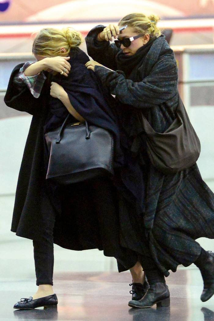 Mary-Kate and Ashley Olsen arriving at LAX in 2014 