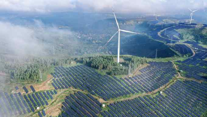 Wind turbines stand on a hill in Shandong province, China. In the power sector, fossil fuel use will probably peak this year and begin to fall from 2024 at an accelerating pace