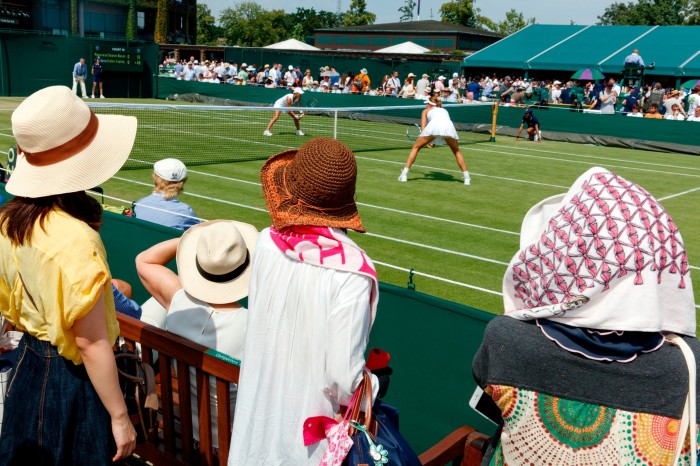 Spectators watching at match at Wimbledon in 2015, as photographed by documentary photographer Martin Parr