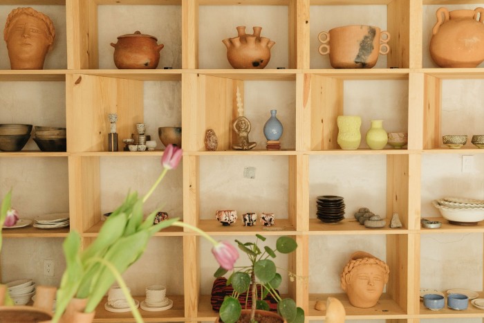 Shelves feature works by Raina Lee, Perla Valtierra, Philip Kupferschmidt and others. 