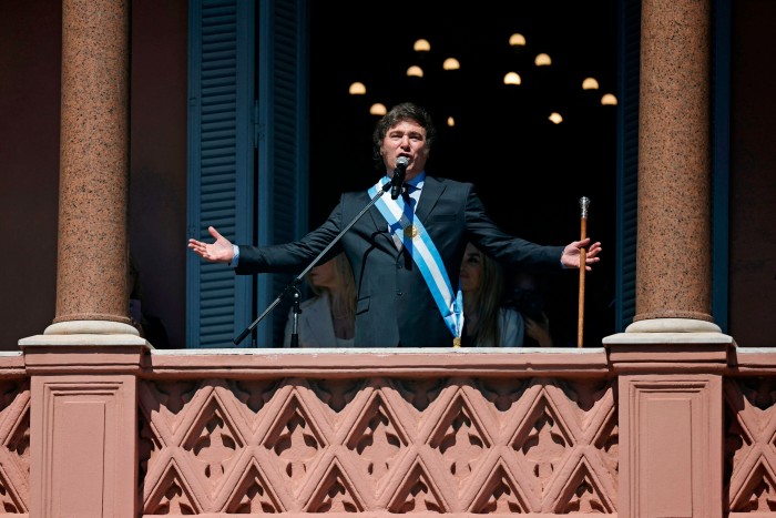     Javier Milei addresses the crowd from the balcony of the Casa Rosada government palace during his inauguration