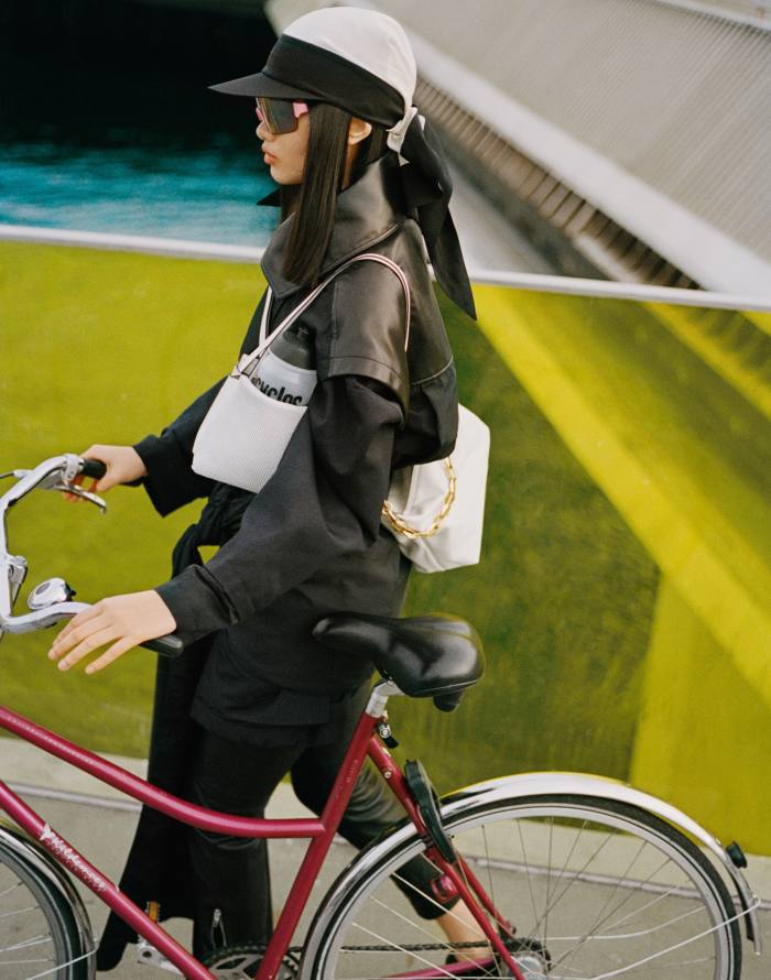 Chun wears Alaïa silk-mix and leather jacket, £2,460. Isabel Marant leather trousers, POA. By Malene Birger silk cap, £150. Rapha Pro Team Frameless sunglasses, £128. Jimmy Choo leather Diamond hobo bag, £1,295. Wandler mesh and leather bag, £810. Eytys suede and cotton Kamasu sneakers, £217