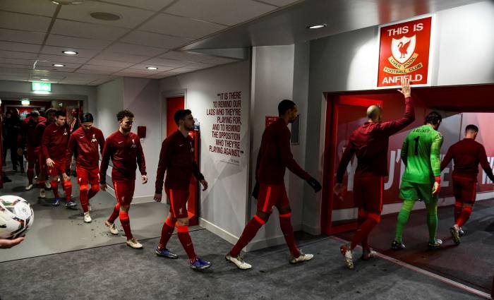 Liverpool player Fabinho touches the ‘This is Anfield’ sign on his way to play against Arsenal in January