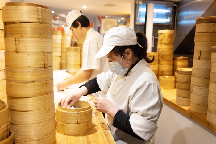 Workers preparing food at Dumplings’ Legend