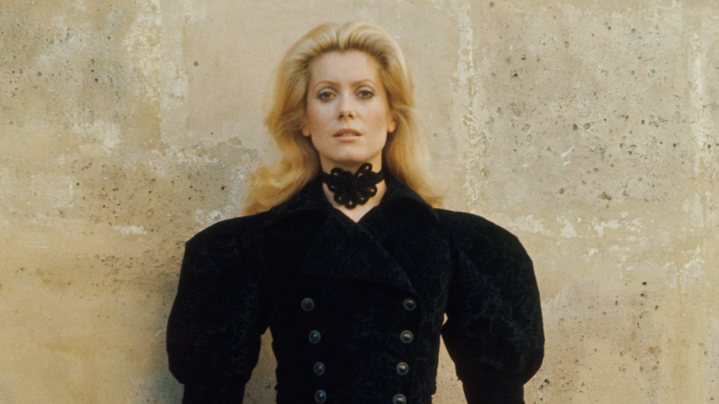 Catherine Deneuve wears the Saint Laurent corduroy coat, auction estimate €1,500-€2,000