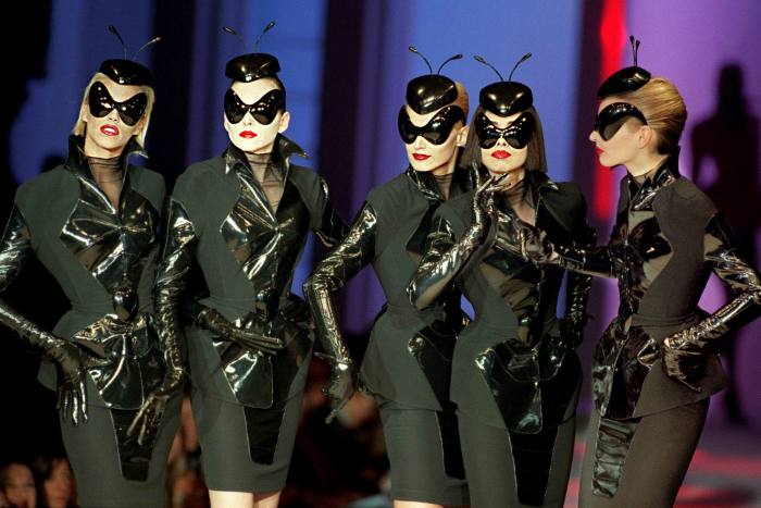 Five models for French designer Thierry Mulger presents black insect inspired suits as part of his 1997 Spring-Summer High fashion show