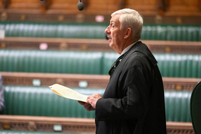     Speaker of the House Lindsay Hoyle with the Tory bench behind him
