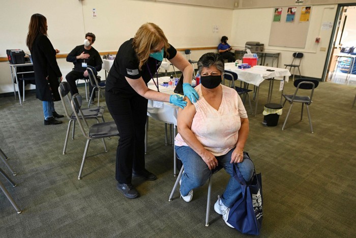 A woman receives a vaccine at a clinic in Los Angeles last week