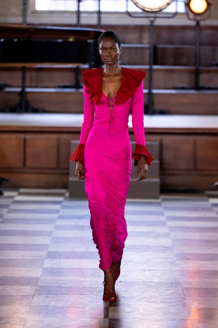 A model in a body-hugging full length gown