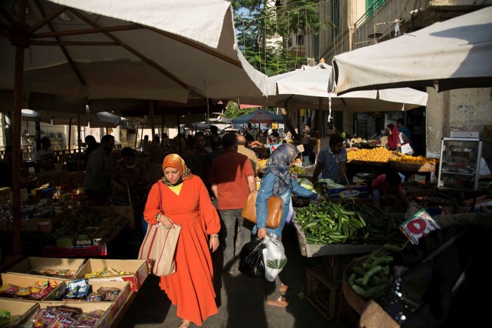 Customers shop at a food market in Cairo. Egypt, the biggest wheat importer in the world, has been badly hit by soaring grain prices, prompting the World Bank to advance a $500mn loan to the country