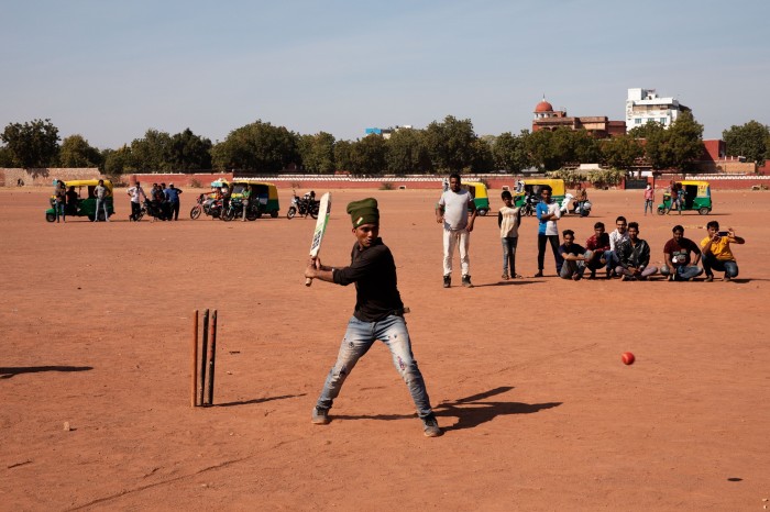 People play cricket on red earth