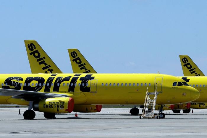 A line of Spirit Airlines jets sits on the tarmac at the Orlando International Airport on May 20 2020 in Orlando, Florida 