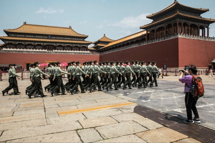 Force demonstration: Soldiers of the People's Liberation Army march past the Forbidden City in Beijing.  China's growing military capacity is causing unrest in Washington