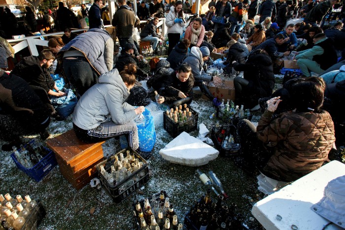 Men and women preparing Molotov cocktails in Uzhhorod, Ukraine