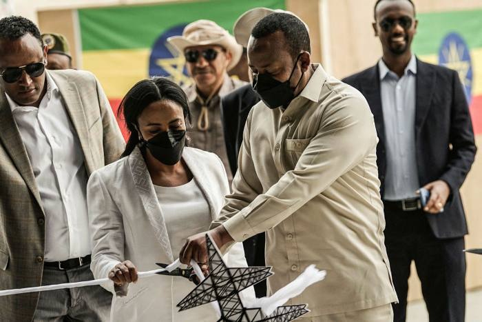 Ethiopia's Prime Minister Abiy Ahmed cuts the ribbon during the opening ceremony of the Grand Ethiopian Renaissance Dam