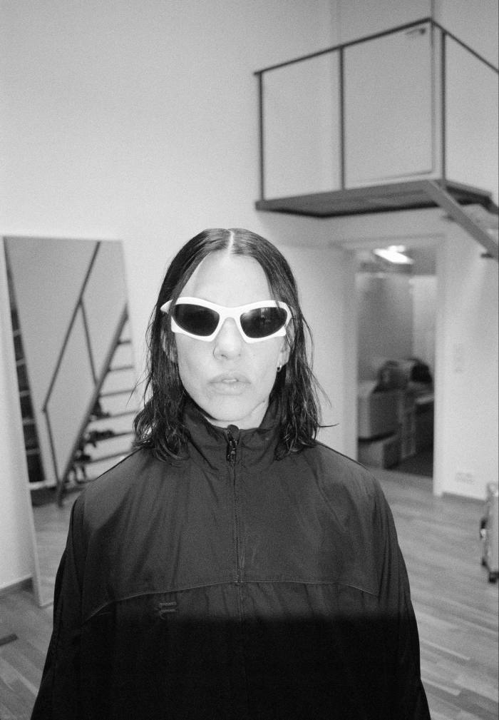 The artist Anne Imhof wearing sunglasses in her Berlin studio