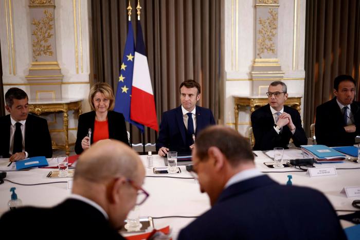 Macron, center, chairs a French Defense Council meeting on February 28 to discuss Russia's invasion of Ukraine