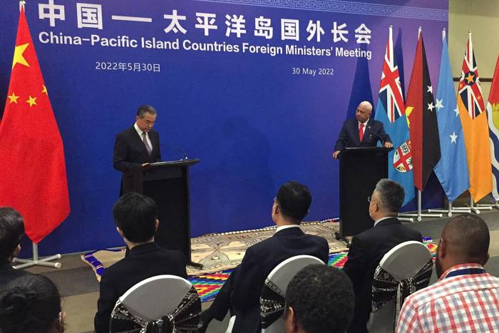Chinese foreign minister Wang Yi and Fijian prime minister Frank Bainimarama attend a joint press conference in Fiji