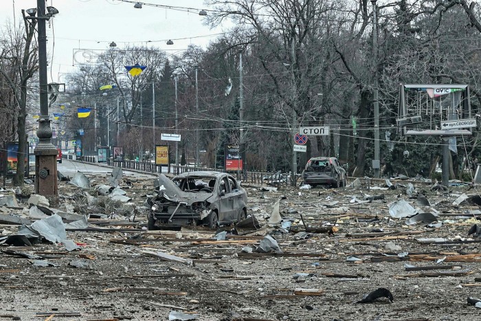 Debris and destroyed cars show the aftermath of Russian shelling in Kharkiv