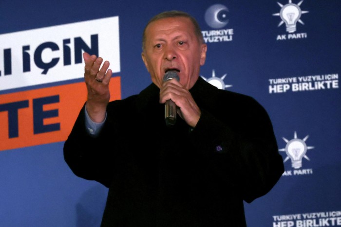 Turkish president Recep Tayyip Erdoğan addresses supporters at the AK Party headquarters after polls closed