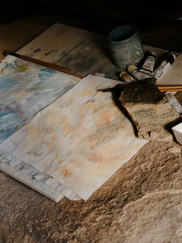 Lou’s materials in her outdoor studio in a rock formation near her home