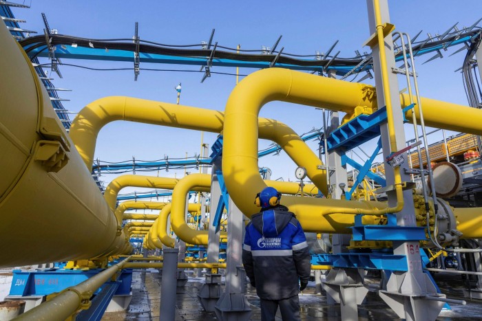 A worker checks the pressure gauge on pipework at the Comprehensive Gas Treatment Unit No.3 of the Gazprom