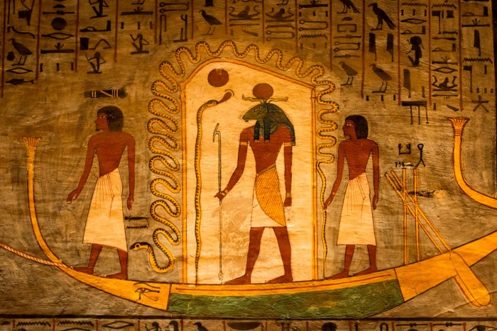 Paintings of gods on the wall of an Egyptian royal tomb