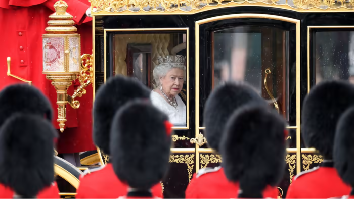 Queen Elizabeth II travels towards the Houses of Parliament before addressing the state opening of parliament in 2016