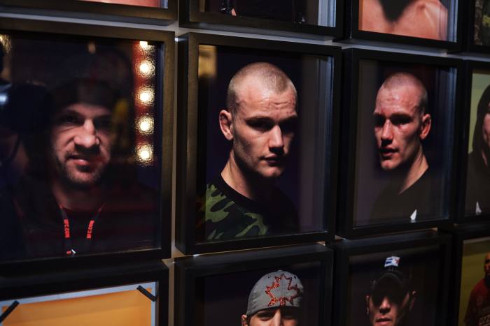 Portraits of fighters before and (looking very bruised) after a fight on the walls of Dana White’s office