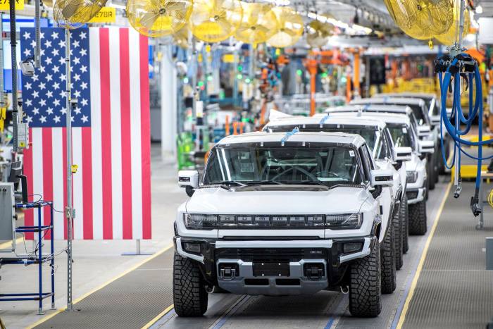 A line of General Motors’ Hummer EVs. GM has pledged to end the sale of any vehicles containing an old-school engine by 2035