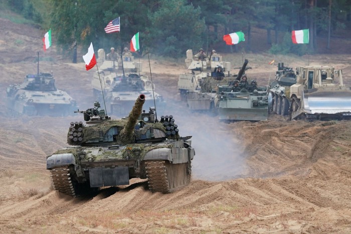 Military vehicles and tanks from Poland, Italy, Canada and the USA roll during NATO military exercises in Latvia