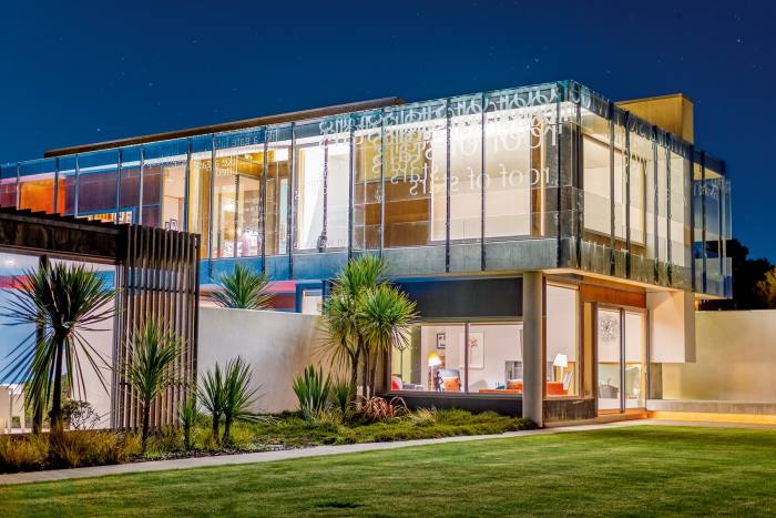 Ponatahi House in Wairarapa, New Zealand, with a poem by Jenny Bornholdt sandblasted into the glass, on sale with Savills at NZ$10.5m (about £5.5m)