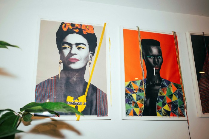 Artwork featuring Frieda Kahlo and Grace Jones on a wall in Ode to Babel