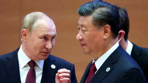 Vladimir Putin, left, gestures while speaking to Chinese President Xi Jinping during the Shanghai Cooperation Organization summit in Samarkand, Uzbekistan, last September
