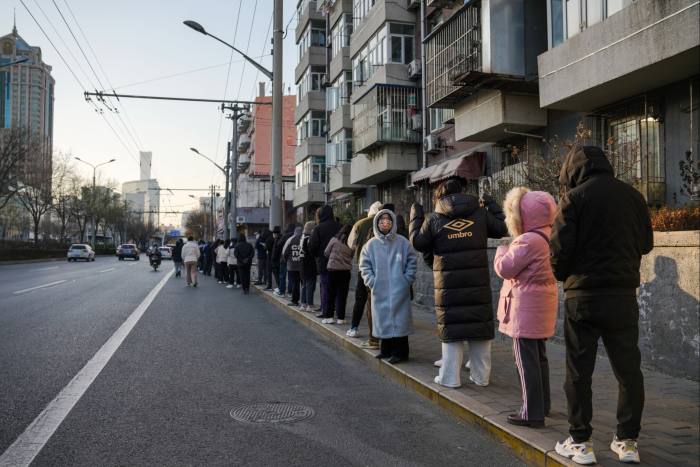Residents queue for Covid-19 tests in Beijing’s Chaoyang district on Sunday
