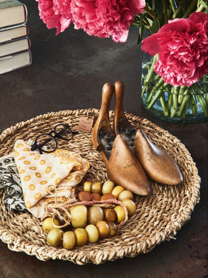 A basket of accessories in Brown and Konig’s home