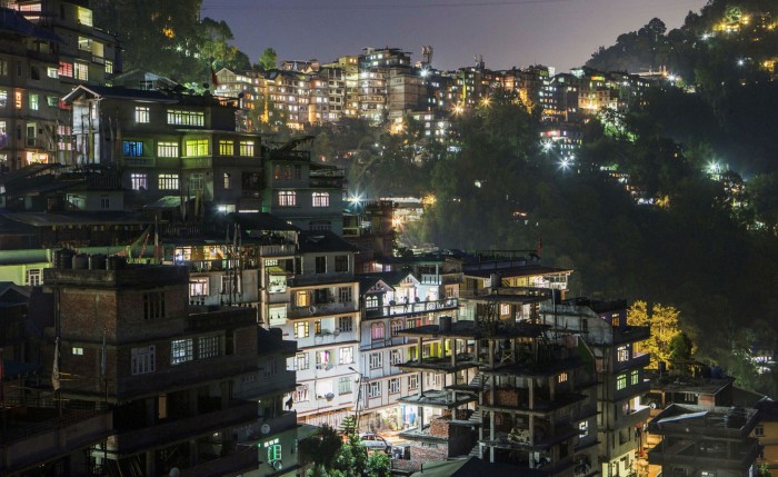 Residential properties are lit up in Sikkim, India. The IMF has estimated that household electric bills would rise 43% on average over the next decade if carbon was taxed appropriately