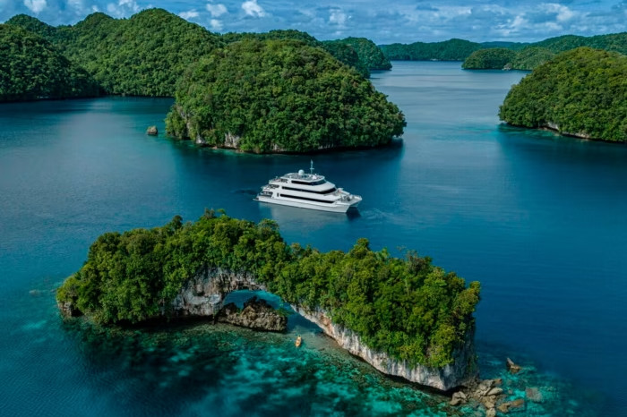 The Explorer yacht navigates through islands 