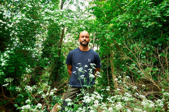 Errol Fernandes, head of horticulture at the Horniman Museum and Gardens, London, surrounded by plants and trees 