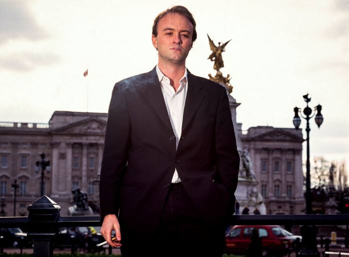 A younger Dominic Cummings poses in front of Buckingham Palace