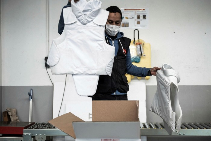 An employee of Médecins Sans Frontières checks bulletproof vests 