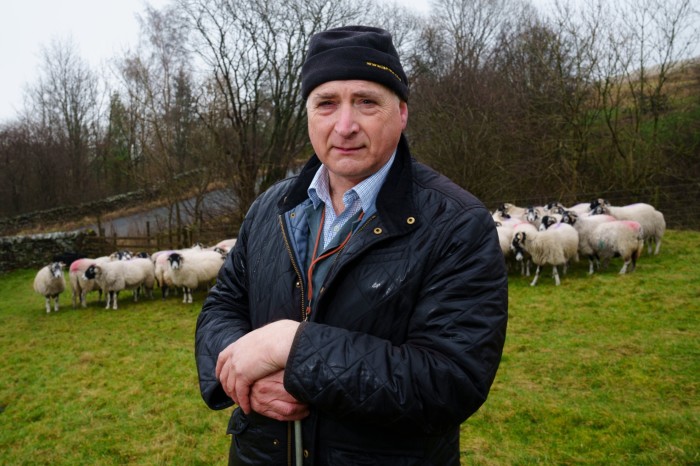 Sheep farmer Thomas Binns on his farm near Clitheroe, Lancashire